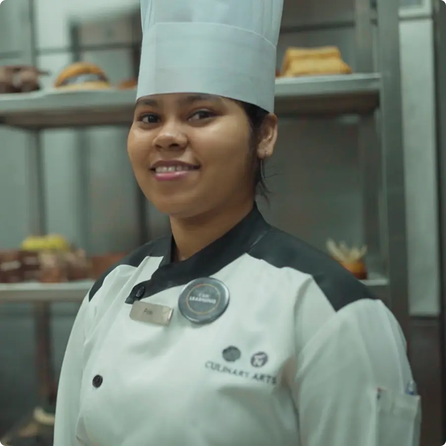 Student in bakery looking at the camera