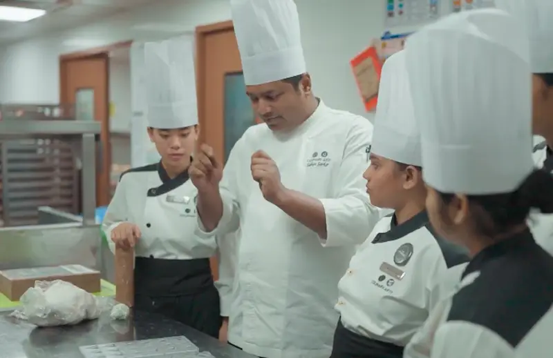 chef talking with his students